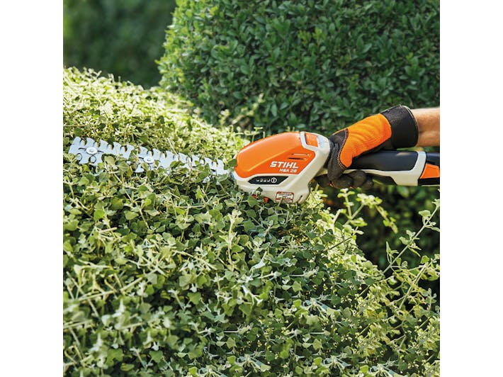 Close up of HSA 26 being used to trim hedge
